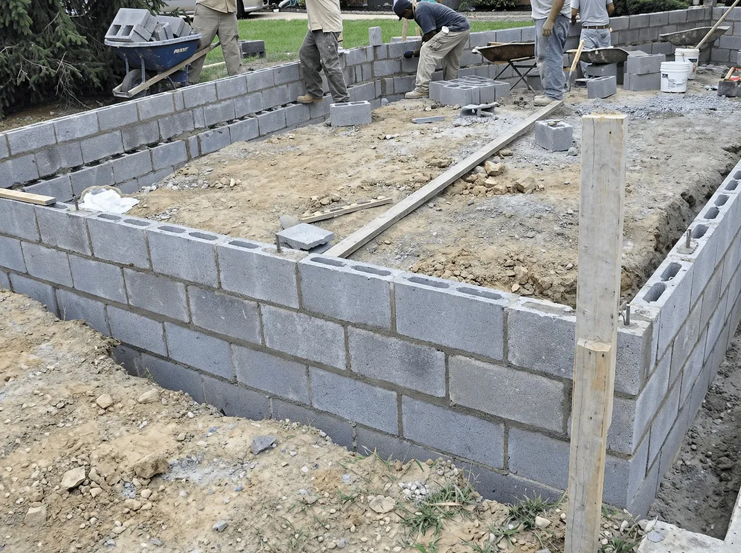 Professionals building a foundation with blocks in Fort Collins, CO